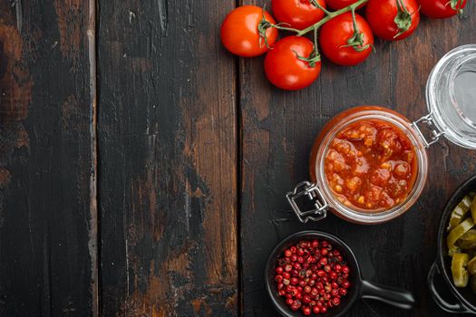 Salsa sauce and ingredient, on old dark wooden table background, top view flat lay with copy space for text