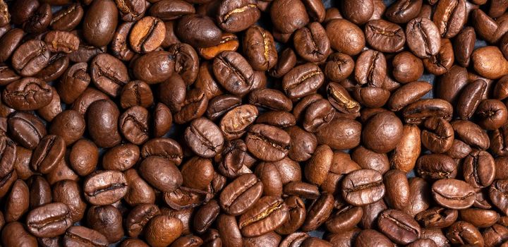 Fresh brown roasted coffee beans background