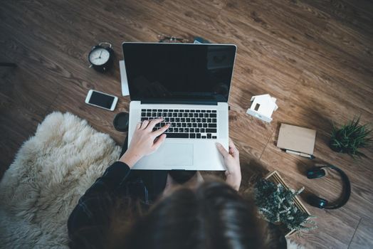 Work From Home for Social Distancing in Coronavirus Covid-19 Situation, Woman Designer Using Laptop on Flooring Carpet at Her Home. Above View of Creative Design Woman is Working Online at Home