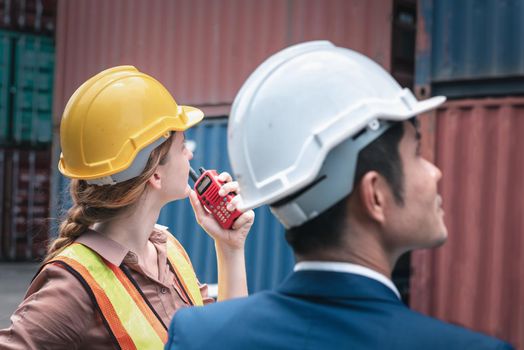 Business Team Container Cargo Shipping Control Inspection Loading Dock and Management Import/Export Freight at Port Ship Yard. Manager and Foreman Teamwork Inspecting Containers Shipment Warehouse.