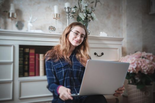 Young Woman Working on Computer Laptop at Home, Businesswoman in Happy Smiling While Online Virtual Conversation on Laptop From Home. Technology Communication and Creative Work at Home Concept