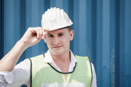Portrait Confident Transport Engineer Man in Safety Equipment Standing in Container Ship Yard. Transportation Engineering Management and Container Logistics Industry, Jobs Shipping Worker Occupation