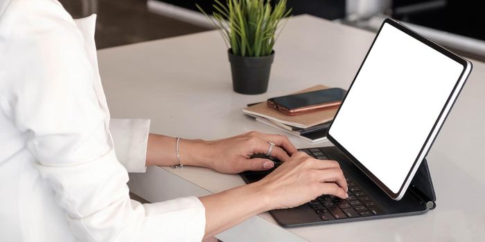 Close up of businesswoman or accountant working laptop financial data report, accountancy document and laptop computer at office, business concept.