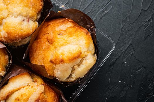 Delicious tasty muffin, on black background, top view flat lay with copy space for text