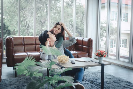 Couple Love Having Coronavirus Covid-19 Quarantine at Home, Portrait of Asian Couple Enjoying in Living Room Together During Quarantined Covid19 at Their House. Couple Relationship Leisure Lifestyle