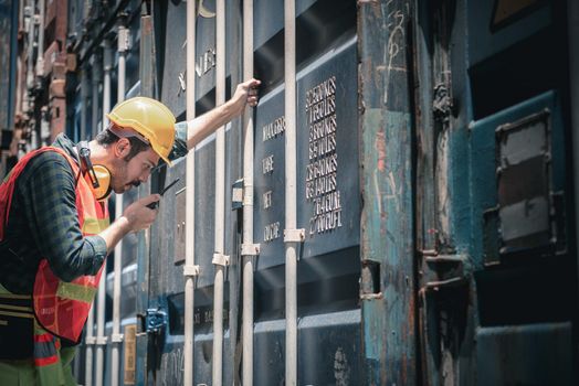 Container Logistics Shipping Management of Transportation Industry, Transport Engineer Managing Control Via Walkie Talkie in Containers Shipyard. Business Cargo Ship Import/Export Factory Logistic.