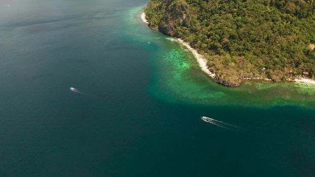 Tropical lagoon with sandy beach, aerial view. El nido, Philippines, Palawan. Seascape with tropical rocky islands, ocean blue water. Summer and travel vacation concept