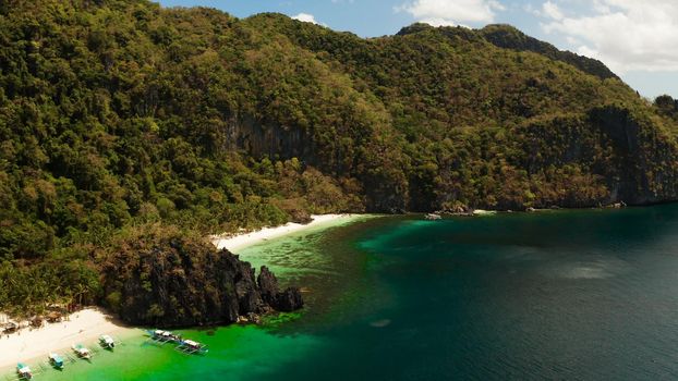 Tropical beach and clear blue water. El nido, Philippines, Palawan. Seascape with tropical rocky islands, ocean blue water. Summer and travel vacation concept