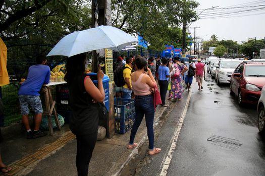 salvador, bahia, brasil - 22 de junho de 2021: Passengers are seen waiting for public transport at a bus stop in the Cabula neighborhood of the city of Salvador, due to a drivers strike.