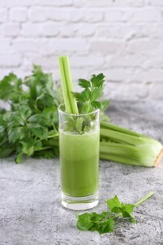 A glass of freshly made celery smoothie. A detox drink for those who care about health