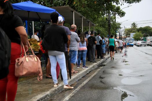 salvador, bahia, brasil - 22 de junho de 2021: Passengers are seen waiting for public transport at a bus stop in the Cabula neighborhood of the city of Salvador, due to a drivers strike.