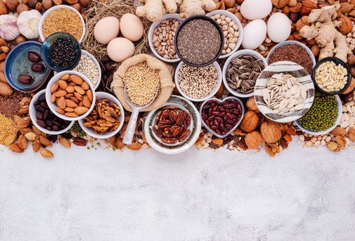 Ingredients for the healthy foods selection. The concept of superfoods set up on white shabby concrete background with copy space.