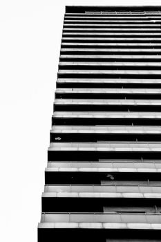 Colossal building plenty of apartments in Alicante, Spain. Monochrome picture.