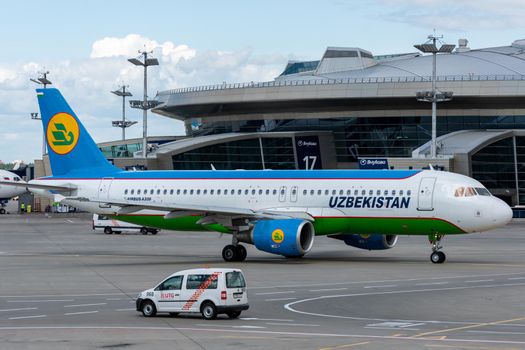 July 2, 2019, Moscow, Russia. Airplane Airbus A320-200  Uzbekistan Airways at Vnukovo airport in Moscow.