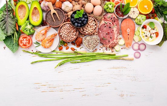 Ketogenic low carbs diet concept. Ingredients for healthy foods selection set up on white wooden background.