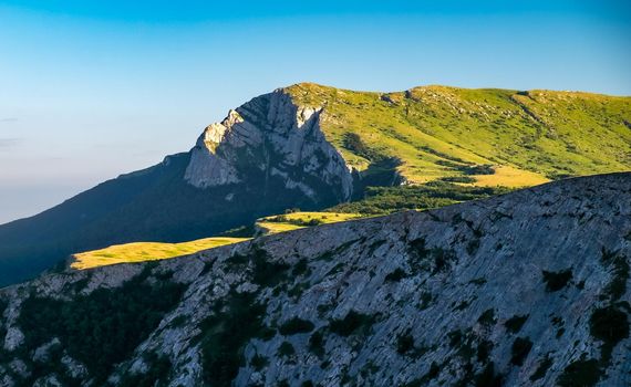 View of the upper plateau of Chatyr-Dag in Crimea in the light of the setting sun.