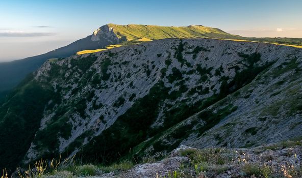 View of the upper plateau of Chatyr-Dag in Crimea in the light of the setting sun.