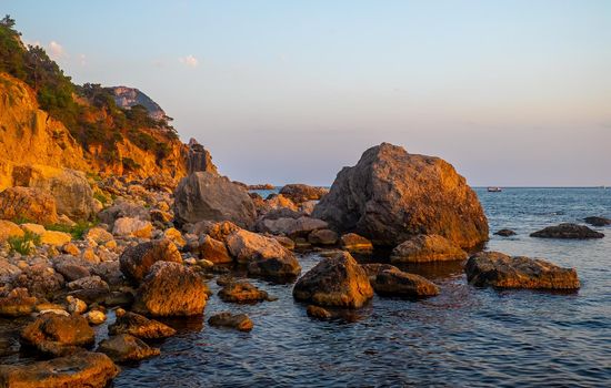 Huge boulders on the shores of a small bay of the Black Sea.