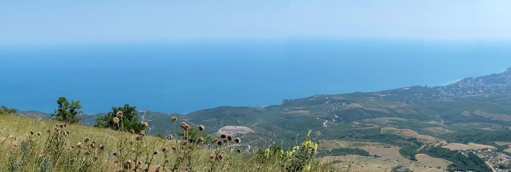 View of the Black Sea coast from the valley of the Demerdzhi mountain range in Crimea.