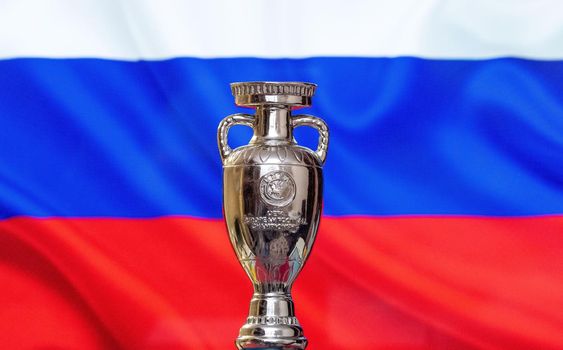 April 10, 2021. St. Petersburg, Russia. UEFA European Championship Cup with the Russian flag in the background.