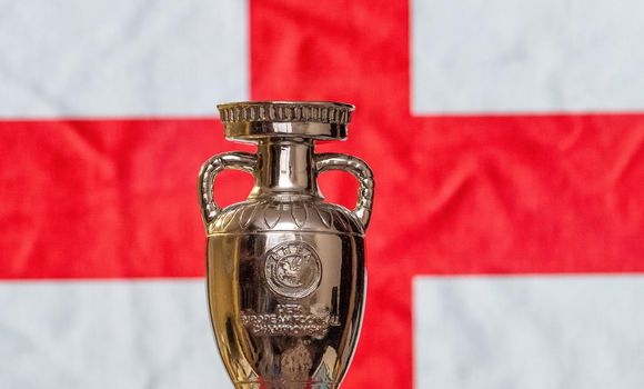 April 10, 2021. London, England. UEFA European Championship Cup with England flag in the background.