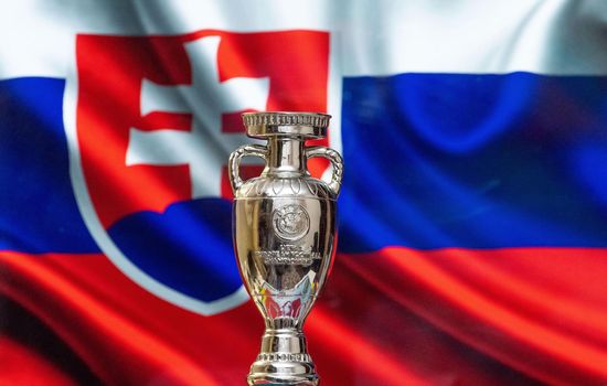 April 10, 2021. Bratislava, Slovakia. UEFA European Championship Cup with the Slovakian flag in the background.