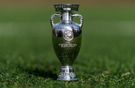 April 13, 2021 Moscow, Russia. The UEFA European Football Championship Cup on the green lawn of the football stadium.