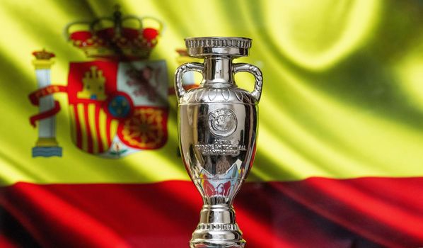 April 10, 2021. Bilbao, Spain. UEFA European Championship Cup with the Spanish flag in the background.