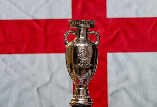 April 10, 2021. London, England. UEFA European Championship Cup with England flag in the background.