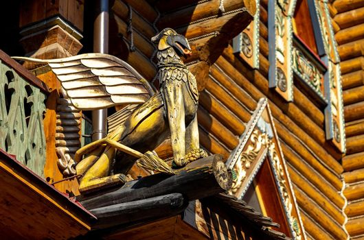 A wooden griffin on the building of the Izmailovsky Kremlin cultural and entertainment complex in Moscow.