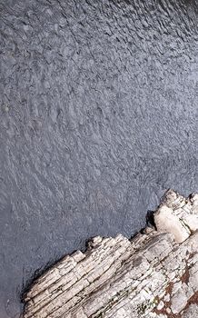 Natural texture: rock on the bank of a mountain river.