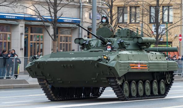 April 30, 2021 Moscow, Russia. Russian tracked infantry fighting vehicle BMP-2 with the Berezhok combat module on Tverskaya Street in Moscow.