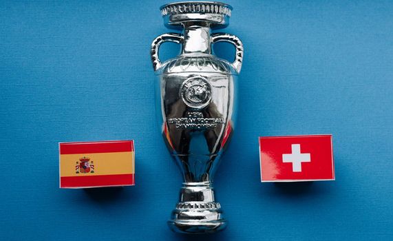 July 1, 2021 St. Petersburg, Russia Flags of the European Football Championship 1/4 finals Spain and Switzerland against the backdrop of the Euro 2020 Cup.