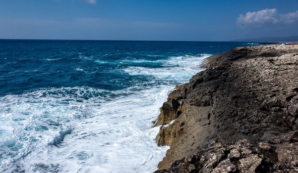 Waves crash on the rocky shore of the Mediterranean Sea on the Akamas Peninsula in the northwest of the island of Cyprus.