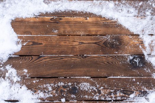 Winter background. Empty wooden plank with snowy border, copy space for text Wood table. For product display Christmas time mock up