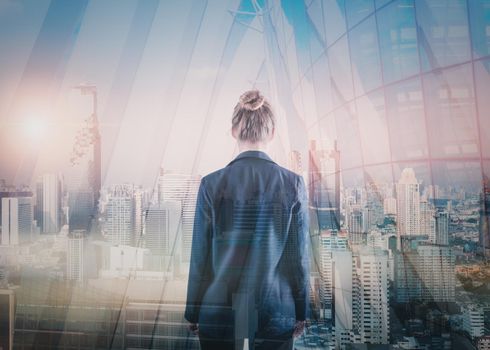 Business Property Development and Investment Concept, Double Exposure of Businesswoman Rear View and Cityscape Buildings. Goal Business Executive Marketing of Successful Entrepreneur