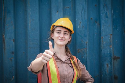 Portrait of Confident Transport Engineer Woman in Safety Equipment Standing in Container Ship Yard. Transportation Engineering Management and Containers Logistics Industry, Shipping Worker Occupation