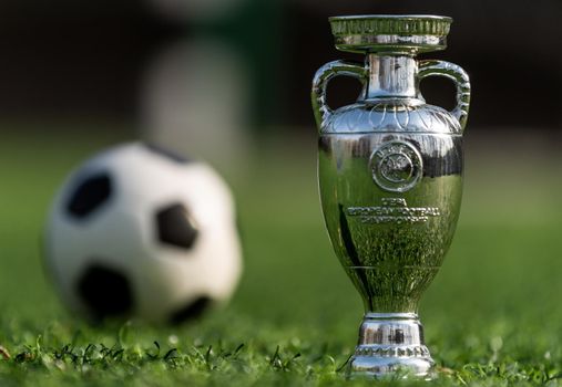 April 13, 2021 Moscow, Russia. The UEFA European Football Championship Cup on the green lawn of the football stadium.