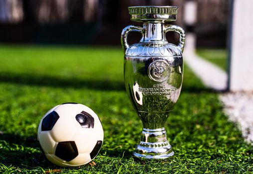 April 13, 2021 Moscow, Russia. The UEFA European Football Championship Cup on the green lawn of the football stadium.