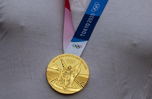 April 17, 2021 Tokyo, Japan. Gold medal of the XXXII Summer Olympic Games in Tokyo on the chest of the athlete.