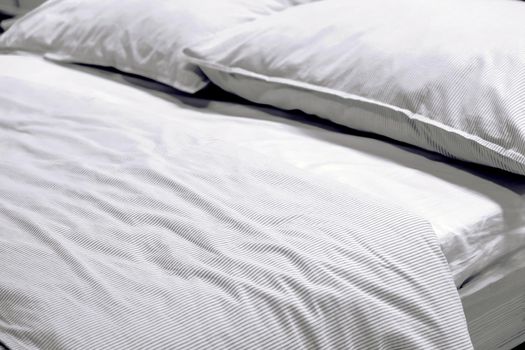 Close up image of Bed mattress Duvet with pillow and blanket