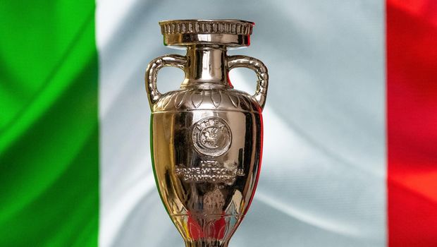 April 10, 2021. Rome, Italy. UEFA European Championship Cup with the Italian flag in the background.