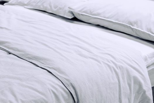 Close up image of Bed mattress Duvet with pillow and blanket