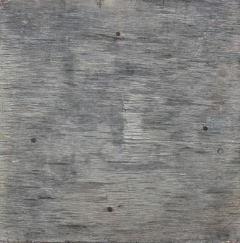 Close up background texture of vintage weathered gray wooden planks with knots and stains