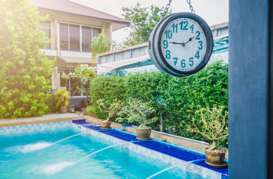 clock near the pool