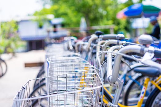 bikes in the parking lot for bicycles, roadside