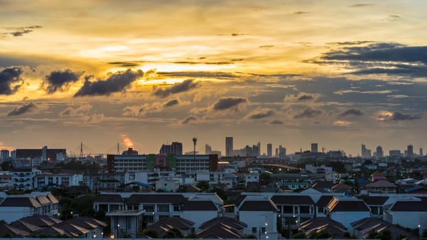 urban and cloudy sky in cityscape at evening time