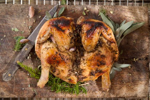 Presentation of a marinated chicken with herbs and baked in the oven