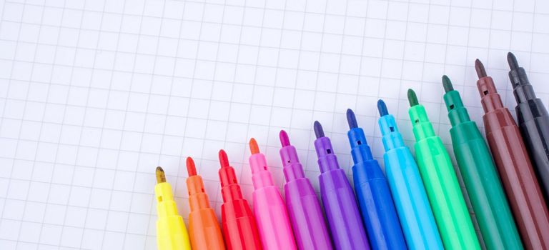 Colorful felt-tip pens on a notebook