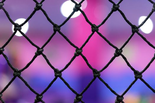 Rope mesh with blurry background in children playground